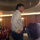 Andrew Wakefield, mid-presentation, listening to a question from an audience member.